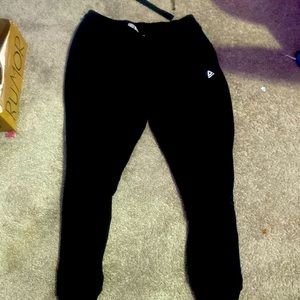 Black sweats, cuffed at ankle, good quality